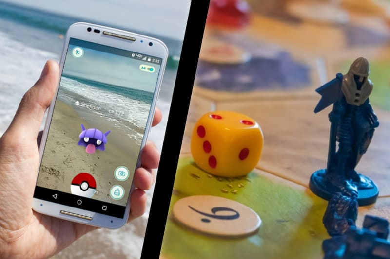 This Picture Is Broken Up Into Two Parts. The Left Side There Is A Hand Holding A Smartphone, Trying To Catch A Pokemon. You Can See There Is Ocean In The Background. On The Right Side Of The Picture, There Are Some Dice And Tokens On A Catan Board Game.